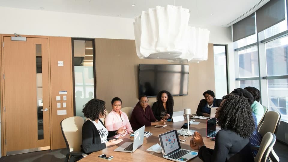 Students in an investment committee session